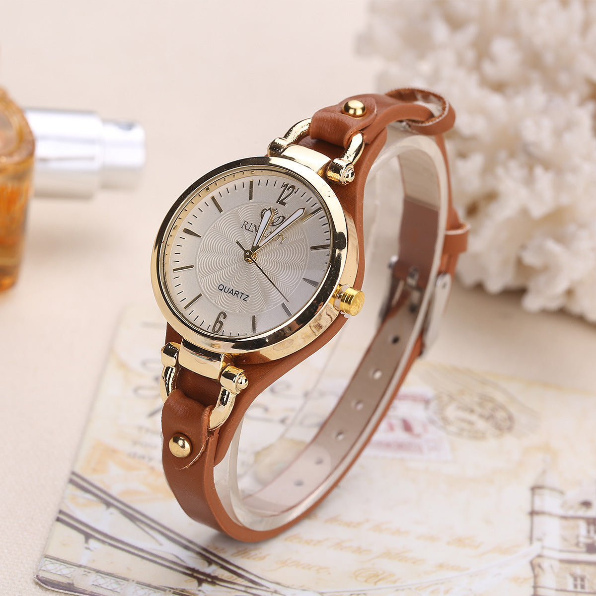 Quartz watch with thin leather strap, solid color,