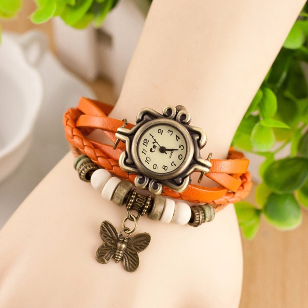 Vintage wristwatch with leather overlay strap