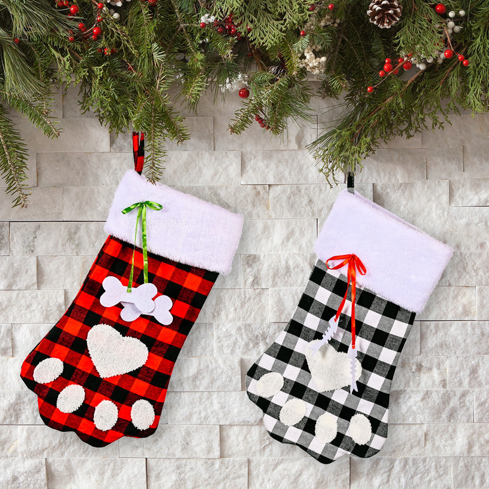 Red and black plaid Christmas socks with dog paws