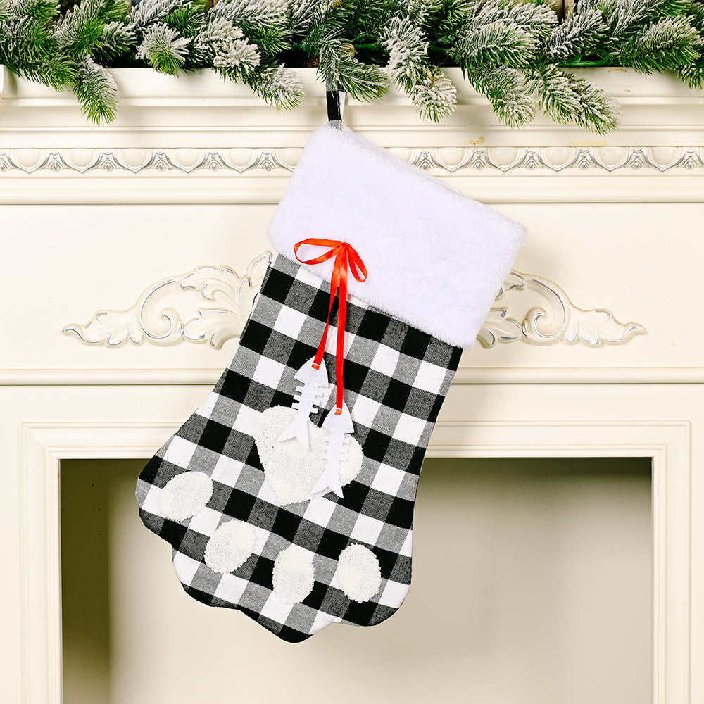 Red and black plaid Christmas socks with dog paws