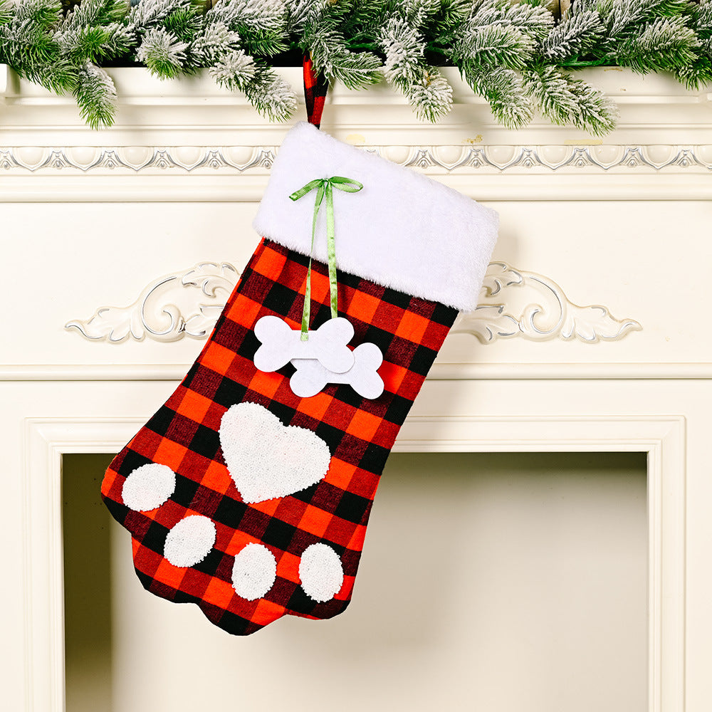 Red and black plaid Christmas socks with dog paws