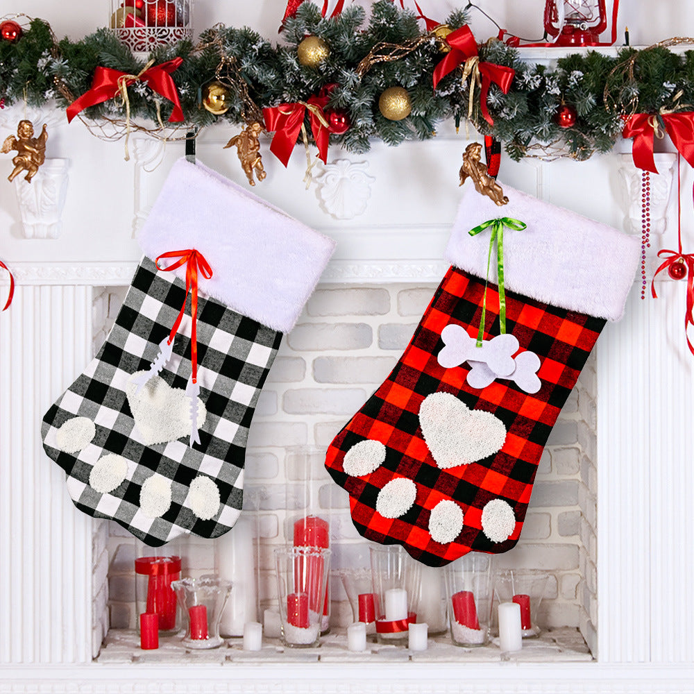 Red and black plaid Christmas socks with dog paws