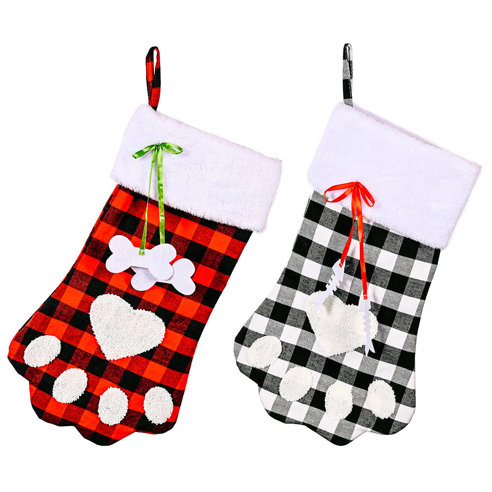 Red and black plaid Christmas socks with dog paws