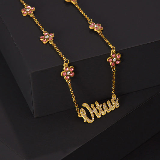 Personalized necklace with diamond-encrusted flower